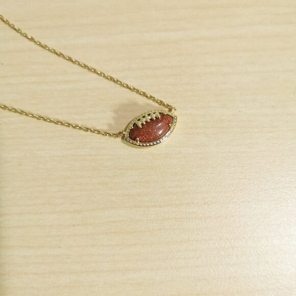Kendra Scott Gold Orange Goldstone Football Pendant Necklace - Picture 3 of 4